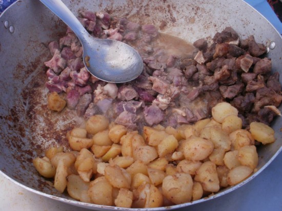 Eating Alpaca Meat in Chivay, Peru. The Main Ingredients in my 50 cent Alpaca Taste Test - Pieces of Alpaca Meat & Potatoes