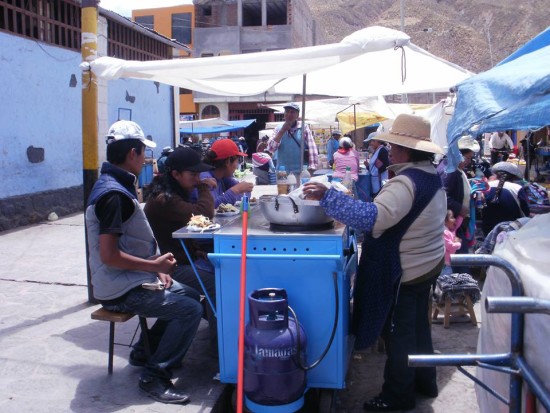 Eating Alpaca Meat in Chivay, Peru. Sitting Outside the Market in Chivay, Peru Eating Alpaca